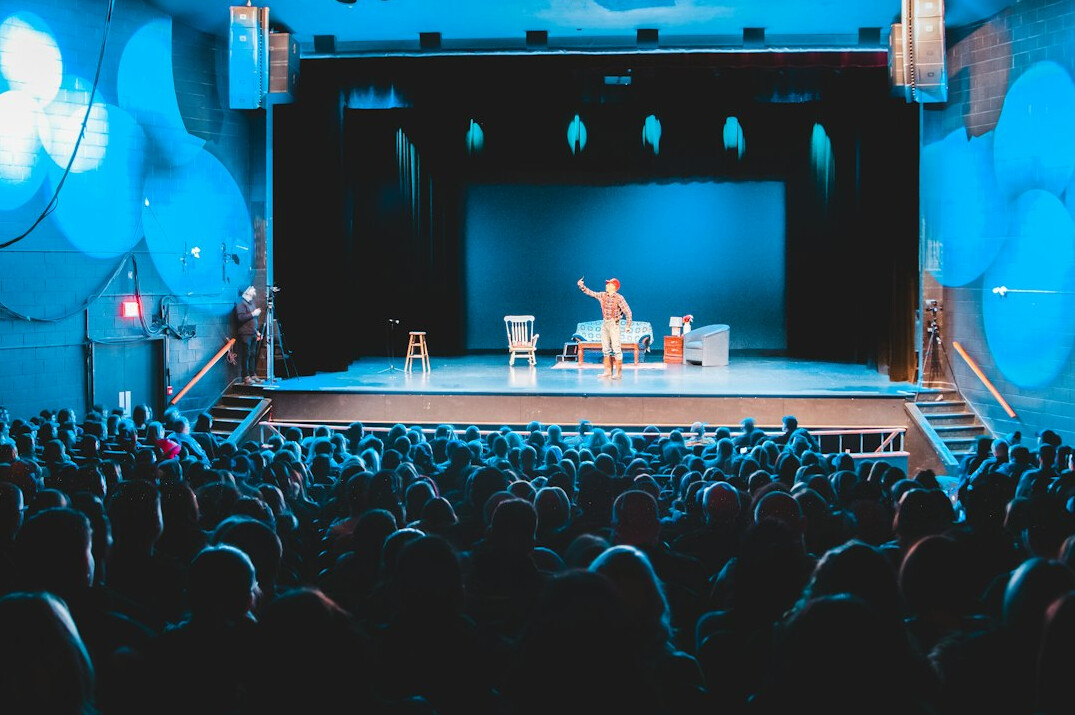 person speaking in front of audience