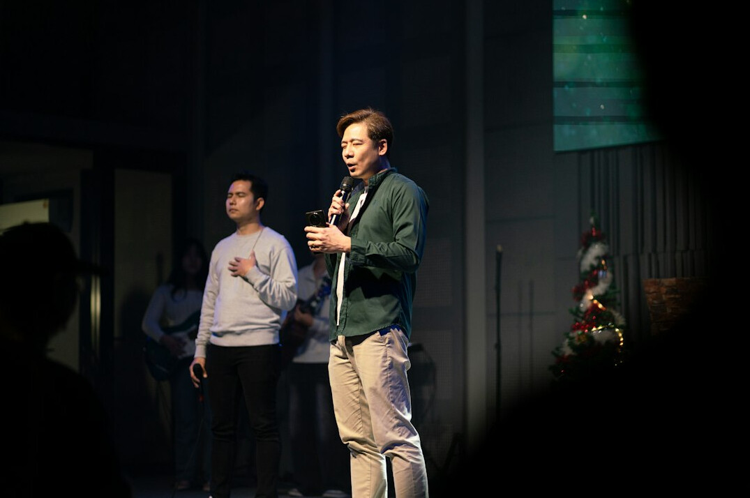 person speaking confidently on stage