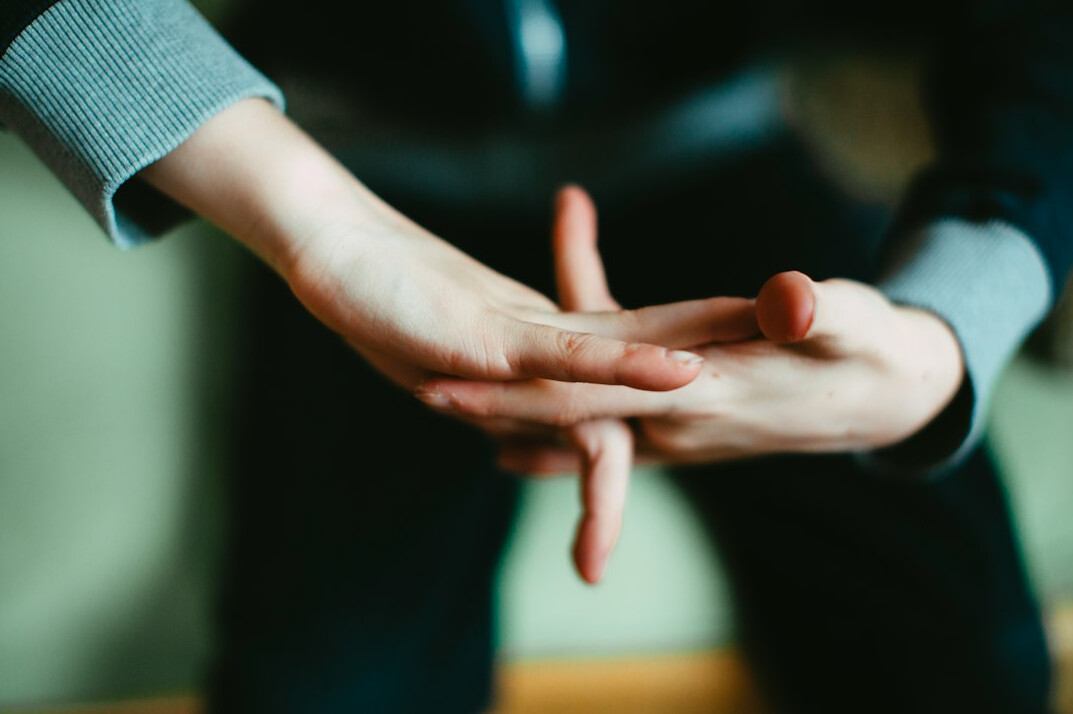 person using hand gestures in conversation